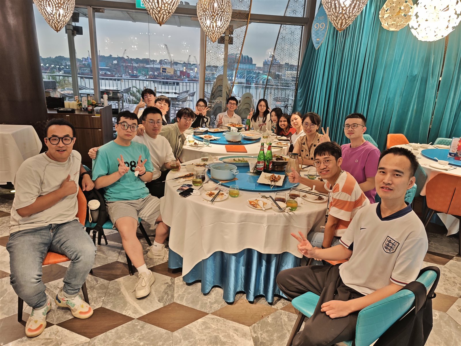 Kawi Research Group members gathered around a dining table for a welcome and farewell event